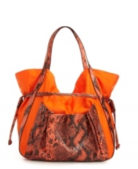 A casual nylon silhouette accented with a bold snakeskin print. This fierce drawstring bag from FALCHI by Falchi features a roomy interior for holding all your chic necessities, and so much more. A casual nylon silhouette accented with a bold snakeskin print. This fierce drawstring bag from FALCHI by Falchi features a roomy interior for holding all your chic necessities, and so much more.