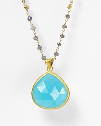 Small gray iolite stones lead to a dazzling, sky-blue faceted chalcedony pendant. By Coralia Leets. Small gray iolite stones lead to a dazzling, sky-blue faceted chalcedony pendant. By Coralia Leets.