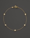 Diamond stations punctuate an elegant 18K white gold chain. By Roberto Coin.