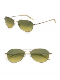 A revised look for the classic aviator style, designed with double-bridge detail and metal frames. Available in gold frames with gradient peridot lenses. 100% UV protective Imported 