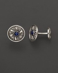 Elegant, intricately textured sterling silver cufflinks, set with sapphires, from Buccellati. Elegant, intricately textured sterling silver cufflinks, set with sapphires, from Buccellati.