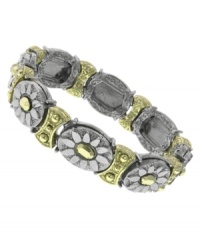 A natural selection. 2028's pretty bracelet feature a unique oval and floral pattern in silver and gold tone mixed metal. Bracelet stretches to fit wrist. Approximate diameter: 2-1/2 inches. A natural selection. 2028's pretty bracelet feature a unique oval and floral pattern in silver and gold tone mixed metal. Bracelet stretches to fit wrist. Approximate diameter: 2-1/2 inches.