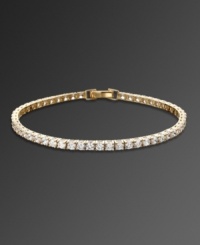 Sparkle never looked so sweet. CRISLU's head-turning tennis bracelet features a chic row of round-cut cubic zirconias (5-1/5 ct. t.w.) set in gold over sterling silver. Approximate length: 7 inches. Sparkle never looked so sweet. CRISLU's head-turning tennis bracelet features a chic row of round-cut cubic zirconias (5-1/5 ct. t.w.) set in gold over sterling silver. Approximate length: 7 inches.