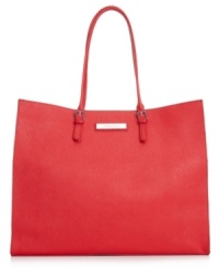 Shoulder this impossibly chic silhouette from Calvin Klein with elegance and ease. Crafted from soft Saffiano leather with gleaming hardware, its spacious design makes it the perfect companion for workdays or weekends away. Shoulder this impossibly chic silhouette from Calvin Klein with elegance and ease. Crafted from soft Saffiano leather with gleaming hardware, its spacious design makes it the perfect companion for workdays or weekends away.