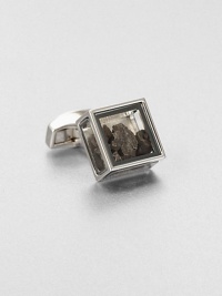 Inspired by the tale of Pandora's box in Greek mythology and featuring the Tateossian signature element of surprise, this glass-box cuff link holds iron meteorites. The Campo del Cielo meteorites originate from the 5000 year old crater found in Argentina, in 1576, each iron meteorite has a rough and natural shape.Sold separatelyBrass and glassEnamel trimMade in United Kingdom Inspired by the tale of Pandora's box in Greek mythology and featuring the Tateossian signature element of surprise, this glass-box cuff link holds iron meteorites. The Campo del Cielo meteorites originate from the 5000 year old crater found in Argentina, in 1576, each iron meteorite has a rough and natural shape.Sold separatelyBrass and glassEnamel trimMade in United Kingdom