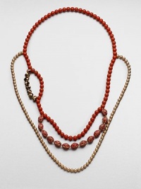 An artistic and colorful design with faceted, smooth and decorated beads in an abstract style. Glass and acrylic beadsLength, about 36Slip-on styleImported An artistic and colorful design with faceted, smooth and decorated beads in an abstract style. Glass and acrylic beadsLength, about 36Slip-on styleImported