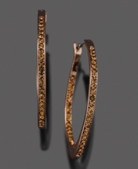 A soft, eye-catching hue adds originality and intrigue to these gorgeous earrings by Fossil. Featuring crystal accents set in brown ion-plated mixed metal. Approximate diameter: 1-1/4 inches. A soft, eye-catching hue adds originality and intrigue to these gorgeous earrings by Fossil. Featuring crystal accents set in brown ion-plated mixed metal. Approximate diameter: 1-1/4 inches.