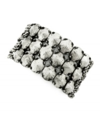 Slip this vintage-inspired piece over your wrist for a retro chic look. BCBGeneration's cuff bracelet features a circular, three row pattern in oxidized silver tone mixed metal. Bracelet stretches to fit wrist. Approximate diameter: 1-1/2 inches. Slip this vintage-inspired piece over your wrist for a retro chic look. BCBGeneration's cuff bracelet features a circular, three row pattern in oxidized silver tone mixed metal. Bracelet stretches to fit wrist. Approximate diameter: 1-1/2 inches.