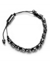 Subtle edginess. Ali Khan's silver and hematite-plated mixed metal bracelet features several tiny skulls along a black-colored cord. Bracelet is fully adjustable. Approximate length: 12 inches. Approximate diameter: 2 inches.