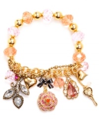 An amalgamation of charms. Betsey Johnson's bracelet highlights pink faceted beads with a half-stretch chain. Bracelet is decorated with a ombre-colored pave crystal rose, crystal leaves, a pink teardrop crystal, gold-tone bubble hearts, and pink faceted beads. Set in gold tone mixed metal. Approximate length: 7-1/2 inches. An amalgamation of charms. Betsey Johnson's bracelet highlights pink faceted beads with a half-stretch chain. Bracelet is decorated with a ombre-colored pave crystal rose, crystal leaves, a pink teardrop crystal, gold-tone bubble hearts, and pink faceted beads. Set in gold tone mixed metal. Approximate length: 7-1/2 inches.