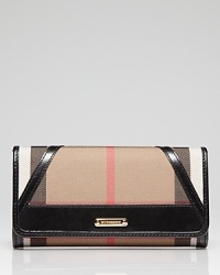 Keep your cash (and card) cache organized with Burberry's check wallet. Take the plaid package into after hours--it doubles as a preppy chic clutch with a black sheath and kitten heels. Keep your cash (and card) cache organized with Burberry's check wallet. Take the plaid package into after hours--it doubles as a preppy chic clutch with a black sheath and kitten heels.