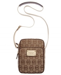 The ideal jet-setting companion. This classic monogram flight bag from MICHAEL Michael Kors is the perfect travel-ready size to hold all your essentials while keeping your hands free. The ideal jet-setting companion. This classic monogram flight bag from MICHAEL Michael Kors is the perfect travel-ready size to hold all your essentials while keeping your hands free.