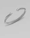 From the Color Classic Collection. A signature Yurman cable of sterling silver, richly enhanced by bands of pavé diamonds, encircling the end caps. Diamonds, 0.09 tcw Sterling silver Cable, 5mm Diameter, about 2½ Made in USA