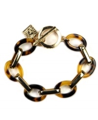 Get linked in. A single strand of gold-tone links mingle with tortoise shell for classically-styled confidence. Slip on this ever-chic flex design from Anne Klein with ease. Set in gold-tone mixed metal with toggle closure. Approximate length: 7-1/2 inches. Get linked in. A single strand of gold-tone links mingle with tortoise shell for classically-styled confidence. Slip on this ever-chic flex design from Anne Klein with ease. Set in gold-tone mixed metal with toggle closure. Approximate length: 7-1/2 inches.