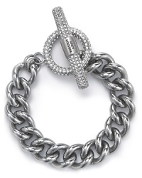 This is a classic accessory that no jewel box should be missing. Cast in metal plate with inset rhinestones, this bracelet from Juicy Couture is ready to hit the links. This is a classic accessory that no jewel box should be missing. Cast in metal plate with inset rhinestones, this bracelet from Juicy Couture is ready to hit the links.