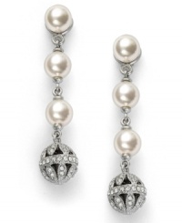 Polished to perfection. Eliot Danori's elegant drop earrings feature 3 shimmering simulated pearls (6 mm) set in rhodium-plated mixed metal with a glass ball accent. Approximate drop: 1-1/4 inches. Polished to perfection. Eliot Danori's elegant drop earrings feature 3 shimmering simulated pearls (6 mm) set in rhodium-plated mixed metal with a glass ball accent. Approximate drop: 1-1/4 inches.