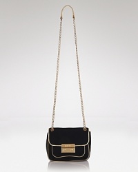 A closet essential: This MICHAEL Michael Kors shoulder bag works a fuss-free glamour, crafted of suede and sized to go from desk to downtown, and everywhere in between. A closet essential: This MICHAEL Michael Kors shoulder bag works a fuss-free glamour, crafted of suede and sized to go from desk to downtown, and everywhere in between.