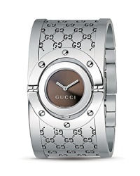 A statement-making cuff watch from Gucci's Twirl Collection in chic stainless steel. Glamorously versatile, the Twirl is characterized by its evocative look and innovative design: the case turns on itself, transforming from timepiece to chic bracelet in a single motion. A statement-making cuff watch from Gucci's Twirl Collection in chic stainless steel. Glamorously versatile, the Twirl is characterized by its evocative look and innovative design: the case turns on itself, transforming from timepiece to chic bracelet in a single motion.