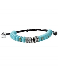 Wrap your wrist in blue hues. The colorful reconstituted turquoise stones on this Fossil bracelet are accented by clear crystal pave. An adjustable chocolate brown leather cord holds it all together. Set in silver tone mixed metal. Approximate diameter: 2-1/2 inches. Wrap your wrist in blue hues. The colorful reconstituted turquoise stones on this Fossil bracelet are accented by clear crystal pave. An adjustable chocolate brown leather cord holds it all together. Set in silver tone mixed metal. Approximate diameter: 2-1/2 inches.