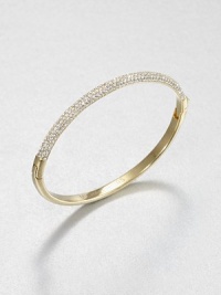 From the Brilliance Collection. Half of this graceful bangle is paved with sparkling rhinestones, the other half has a smooth, polished finish, with a handy hinge in between.GlassGoldtoneDiameter, about 2.5Hinged with push-lock claspImported From the Brilliance Collection. Half of this graceful bangle is paved with sparkling rhinestones, the other half has a smooth, polished finish, with a handy hinge in between.GlassGoldtoneDiameter, about 2.5Hinged with push-lock claspImported