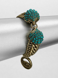 A Hellenic-inspired design that features a turquoise cabochon encrusted station and antique-finished brass link chains. TurquoiseAntique-finished brassLength, about 7.5Spring ring closureImported A Hellenic-inspired design that features a turquoise cabochon encrusted station and antique-finished brass link chains. TurquoiseAntique-finished brassLength, about 7.5Spring ring closureImported