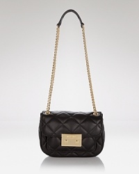 MICHAEL Michael Kors gives us a chic reason to downsize with this miniature leather shoulder bag. In quilted leather with gold tone trims, it encapsulates party-ready polish. MICHAEL Michael Kors gives us a chic reason to downsize with this miniature leather shoulder bag. In quilted leather with gold tone trims, it encapsulates party-ready polish.