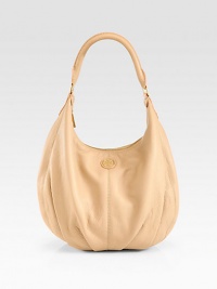 Luxurious pebbled leather in a roomy carryall with a signature logo emblem.Shoulder strap, 10 dropTop zip closureOne inside zip pocketTwo inside open pocketsOne mirrorCanvas lining13W X 10¼H X 4½DImported Luxurious pebbled leather in a roomy carryall with a signature logo emblem.Shoulder strap, 10 dropTop zip closureOne inside zip pocketTwo inside open pocketsOne mirrorCanvas lining13W X 10¼H X 4½DImported