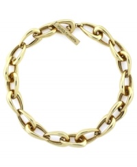 A traditional link to classic style. This golden link necklace from Vince Camuto features oblong links crafted in gold tone mixed metal, includes a toggle closure. Approximate length: 18 inches. A traditional link to classic style. This golden link necklace from Vince Camuto features oblong links crafted in gold tone mixed metal, includes a toggle closure. Approximate length: 18 inches.