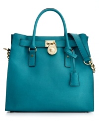 Soft leather and luxurious 18K gold hardware grace this gorgeous design from MICHAEL Michael Kors. This spacious tote shape is ideal for holding all your daily necessities in trés chic style. Soft leather and luxurious 18K gold hardware grace this gorgeous design from MICHAEL Michael Kors. This spacious tote shape is ideal for holding all your daily necessities in trés chic style.