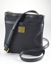 Luxurious touches make all the difference when you're on the go, so make moves with this crossbody from Lauren Ralph Lauren. Crafted from sturdy cotton and finished in leather, this piece will be an easy addition to your practical portfolio. Luxurious touches make all the difference when you're on the go, so make moves with this crossbody from Lauren Ralph Lauren. Crafted from sturdy cotton and finished in leather, this piece will be an easy addition to your practical portfolio.