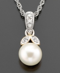 Fresh and joyful, this breathtaking pendant features cultured freshwater pearl (7mm) and diamond accents set in 14k gold and sterling silver. Approximate length: 18 inches. Approximate drop: 1/2 inch. Fresh and joyful, this breathtaking pendant features cultured freshwater pearl (7mm) and diamond accents set in 14k gold and sterling silver. Approximate length: 18 inches. Approximate drop: 1/2 inch.