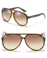 Large rounded aviator sunglasses offer a cool look with Gucci web temple treatment. Nose tabs help to secure fit. Large rounded aviator sunglasses offer a cool look with Gucci web temple treatment. Nose tabs help to secure fit.