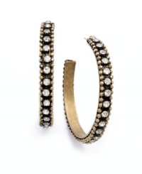 Traditional hoops take a glamorous turn in Bar III's unique style. These three-quarter hoops incorporate both vintage appeal and shine with sparkling clear crystals and hematite tone mixed metal. Approximate diameter: 1-7/8 inches. Traditional hoops take a glamorous turn in Bar III's unique style. These three-quarter hoops incorporate both vintage appeal and shine with sparkling clear crystals and hematite tone mixed metal. Approximate diameter: 1-7/8 inches.