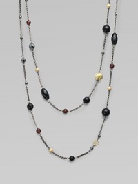 This delicately long design features garnet, hematite, black onyx and 18k gold station beads in various sizes and shapes. Garnet, hematite, black onyx and 18k gold beadsBlacked sterling silverLength, about 36Slip-on styleImported 