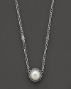 From the Luna Collection, an elegant pearl pendant with silver accents hangs from this chunky 2-station link necklace.Designed by Lagos.
