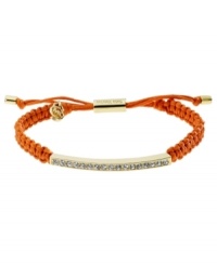 Set the tone for summer! Michael Kors' chic macrame bracelet features woven coral cotton cord with a gold tone mixed metal bar, accented with glistening pave glass stones. Clasp and logo charms crafted in gold tone mixed metal. Approximate diameter: 2 to 2-3/4 inches. Bracelet adjusts to fit wrist. Set the tone for summer! Michael Kors' chic macrame bracelet features woven coral cotton cord with a gold tone mixed metal bar, accented with glistening pave glass stones. Clasp and logo charms crafted in gold tone mixed metal. Approximate diameter: 2 to 2-3/4 inches. Bracelet adjusts to fit wrist.