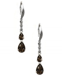 Polish your look with not one, but two, bold pops of color! Judith Jack's stunning drop earrings feature two pear-cut smokey quartz drops (3-5/8 ct. t.w.) and glittering marcasite (1/5 ct. t.w.). Set in sterling silver. Approximate drop: 1-3/4 inches. Polish your look with not one, but two, bold pops of color! Judith Jack's stunning drop earrings feature two pear-cut smokey quartz drops (3-5/8 ct. t.w.) and glittering marcasite (1/5 ct. t.w.). Set in sterling silver. Approximate drop: 1-3/4 inches.