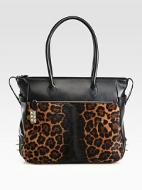 A structured top-handle design in luxe leopard-printed pony hair, finished with smooth leather accents and edgy spikes. Double leather top handles, 9 dropTop zip closureOne outside zip pocketOne outside open pocketProtective metal feetOne inside zip pocketOne inside open pocketSignature red lining14¾W X 12¾H X 4½DMade in Italy A structured top-handle design in luxe leopard-printed pony hair, finished with smooth leather accents and edgy spikes. Double leather top handles, 9 dropTop zip closureOne outside zip pocketOne outside open pocketProtective metal feetOne inside zip pocketOne inside open pocketSignature red lining14¾W X 12¾H X 4½DMade in Italy
