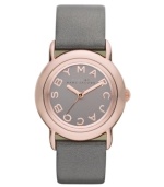 Tastefully trendy. The perfect amount of shimmer and shine accents this watch by Marc by Marc Jacobs. Metallic gray leather strap and round rose-gold ion-plated stainless steel case. Gray mirrored dial features rose-gold tone logo letters at markers and three hands. Quartz movement. Water resistant to 50 meters. Two-year limited warranty.
