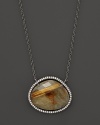 Diamonds circle a faceted rutilated quartz and smoky labradorite doublet set in blackened sterling silver. By Di Massima.
