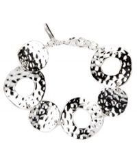 For style that's flexible and flauntable -- just add this chic circular style by Nine West. Crafted in silver tone mixed metal, interlocking circles shine with textured edges. Approximate length: 7-1/4 inches. For style that's flexible and flauntable -- just add this chic circular style by Nine West. Crafted in silver tone mixed metal, interlocking circles shine with textured edges. Approximate length: 7-1/4 inches.
