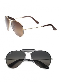 The iconic metal aviator is enhanced with a contrasting brow bar and temple tips in smooth leather. Available in gold frames with crystal brown gradient lenses and silver frames with crystal grey gradient lenses. UV 400 polarized lens 100% UV protective Made in Italy The iconic metal aviator is enhanced with a contrasting brow bar and temple tips in smooth leather. Available in gold frames with crystal brown gradient lenses and silver frames with crystal grey gradient lenses. UV 400 polarized lens 100% UV protective Made in Italy