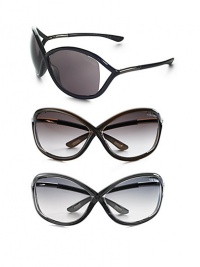 Oversized plastic frame holds a floating lens. Available in black with grey lens, dark brown with brown lens, dark grey with grey lens or transluscent red with brown lens. UV 400 lens 100% UV protective Made in Italy Oversized plastic frame holds a floating lens. Available in black with grey lens, dark brown with brown lens, dark grey with grey lens or transluscent red with brown lens. UV 400 lens 100% UV protective Made in Italy
