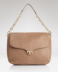 An elegant Tory Burch shoulder bag, poised in silhouette and composed in leather. Its leather strap fits smoothly over the shoulder, making it the ideal for day-to-date night styling. An elegant Tory Burch shoulder bag, poised in silhouette and composed in leather. Its leather strap fits smoothly over the shoulder, making it the ideal for day-to-date night styling.
