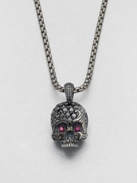 Eye-catching rubies and black diamonds embellish this edgy skull design of sterling silver, suspended from a link chain.Sterling silver/titaniumBlack diamond/rubyAbout 9 diam.Imported Eye-catching rubies and black diamonds embellish this edgy skull design of sterling silver, suspended from a link chain.Sterling silver/titaniumBlack diamond/rubyAbout 9 diam.Imported