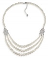 The classic elegance of pearls. Carolee's sophisticated three-row necklace features glass pearls accented by sparkling silver tone spacers with crystal accents. Set in imitation rhodium-plated mixed metal. Approximate length 20 inches + 2-inch extender.