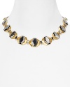 Steal glances when you walk into the room with this Carolee collar necklace, crafted of chunky gold and gunmetal plated stations.