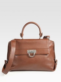 A structured frame-top design of luxe pebble-grain leather with a versatile strap and signature hardware. Top handle, 4¾ dropAdjustable detachable shoulder strap, 18¼-20½ dropToggle closure on front flapProtective metal feetOne inside zip pocketTwo inside open pocketsFully lined13¾W X 9¼H X 6DMade in Italy A structured frame-top design of luxe pebble-grain leather with a versatile strap and signature hardware. Top handle, 4¾ dropAdjustable detachable shoulder strap, 18¼-20½ dropToggle closure on front flapProtective metal feetOne inside zip pocketTwo inside open pocketsFully lined13¾W X 9¼H X 6DMade in Italy