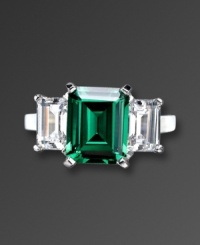 Finish your look with precision style and vibrant color. CRISLU's eye-catching ring highlights an emerald-cut green cubic zirconia center (6 ct. t.w.) with a clear cubic zirconia (2-1/2 ct. t.w.) on either side. Ring crafted in platinum over sterling silver. Sizes 5, 6, 7, 8, and 9.