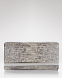 This MICHAEL Michael Kors wallet fits the bill for busy days on the go, crafted of exotically-embossed leather with ample essential-organizing pockets. This MICHAEL Michael Kors wallet fits the bill for busy days on the go, crafted of exotically-embossed leather with ample essential-organizing pockets.